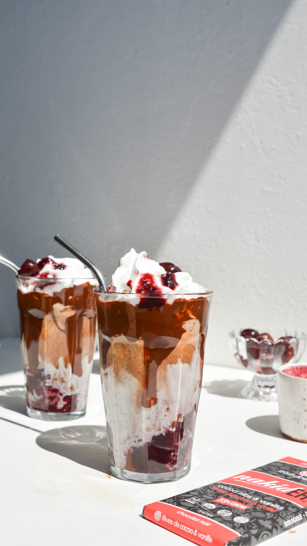 Make a deliciously refreshing glass of iced cherry mocha for Canada Day, using @Zazubean’s dairy-free dark chocolate NAKID bar (peep the limited edition 🇨🇦 Day wrappers!) 🍒☕️🍫

Makes: 2 servings (12oz each)

Ingredients:
* 1 cup fresh or frozen cherries, pitted + 2 more for topping
* 3 tbsp granulated sugar
* 1 NAKID bar, chopped
* 2-4 shots espresso (1-2 each serving)
* Ice cubes
* ~400ml non-dairy milk, such as oat, soy, or almond, divided
* Coconut whipped cream (optional)

Directions:
1. Make the cherry sauce: In a small saucepan on medium heat, simmer the cherries with sugar until softened, about 8-10mins. Allow to cool slightly, then use an immersion blender or transfer to a blender and blend until saucy. You can blend or more less depending on your preference. Cool completely. 
2. Melt the NAKID and mix about half with the hot espresso shots. 
3. Drizzle the other half of the melted NAKID on the sides of two 12oz serving glasses. 
4. Assemble the drinks: ice cubes → cherry sauce → non-dairy milk → espresso+chocolate mix → coconut whipped cream → more cherry sauce → cherry topping. Serve immediately! 

If you try this recipe, don’t forget to share your creations and tag @foodbylingling and @Zazubean for a chance to be featured on our stories! 😎

-LL🤍
#Zazubean #cherrymocha #veganchocolate #summerdrinks #icedmocha