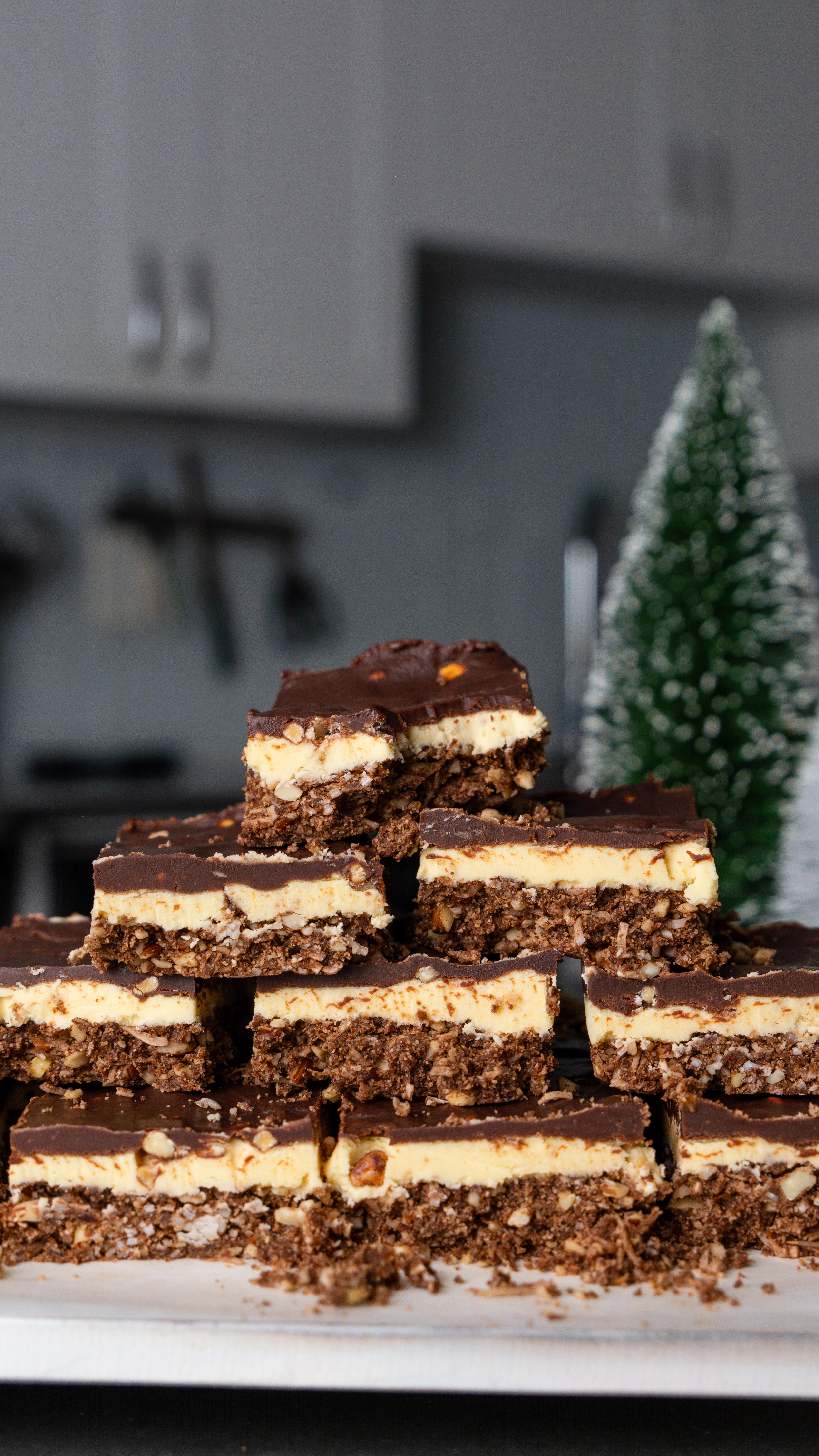 As a BC girlie, no dessert brings me more comfort than Nanaimo bars 🍫🎄🤎 I made these with @Zazubean DANCER Almond Toffee bars for extra texture and toasty flavour! 

These gluten-free, dairy-free, and egg-free Nanaimo bars consist of three components: an almond coconut base, a custard filling, and a DANCER ganache topping. They’re great for potlucks and as a midday snack! 

Makes: 8x8 or 9x9 baking pan (16 squares)

Ingredients:
Almond coconut base
* 1 cup + 2 tbsp almond flour
* ¾ cup almonds (save some chopped for topping) 
* ¾ cup unsweetened shredded coconut 
* 3 tbsp coconut oil, softened 
* 3 tbsp cocoa powder 
* ½ cup medjool dates, pitted
Custard cream filling
* 2 tbsp vegan custard powder
* ¼ cup unsalted vegan butter, softened 
* 2 cups powdered sugar
* 2-3 tbsp coconut cream
Ganache topping
* 2 Zazubean Almond Toffee DANCER bars
* ¼ cup coconut cream 
* 2 tbsp granulated sugar

Directions:
1. Make the almond coconut base: using a food processor or blender, pulse all the ingredients until coarse and semi-binded. Press the crumbs into a 9x9 baking pan lined with parchment paper. Cover and chill in the fridge. 
2. Meanwhile, make the custard cream filling: beat the vegan butter and coconut cream until smooth. Sift in the powdered sugar and vegan custard powder and beat until smooth. Don’t need to beat until fluffy. 
3. Spread the custard mixture on top of the chilled base and chill in the fridge again.
4. Make the chocolate ganache topping: melt the DANCER bars, coconut cream,  and sugar in a saucepan on medium heat. Mix until the chocolate is fully melted, the sugar is dissolved, and the ganache is smooth. 
5. Pour the ganache on top of the cream layer. Cover and chill in the fridge for at least 2hrs, or overnight. 
6. Run a knife under warm water and slice into as many pieces as desired! Store in the fridge. 

If you try this recipe, don’t forget to share your creations and tag us @foodbylingling and @zazubean 🥰

-LL🤍
#Zazubean #veganchocolate #easyveganrecipes #vegandesserts #nanaimobars #chocolatedesserts #glutenfreedesserts #holidaydessert